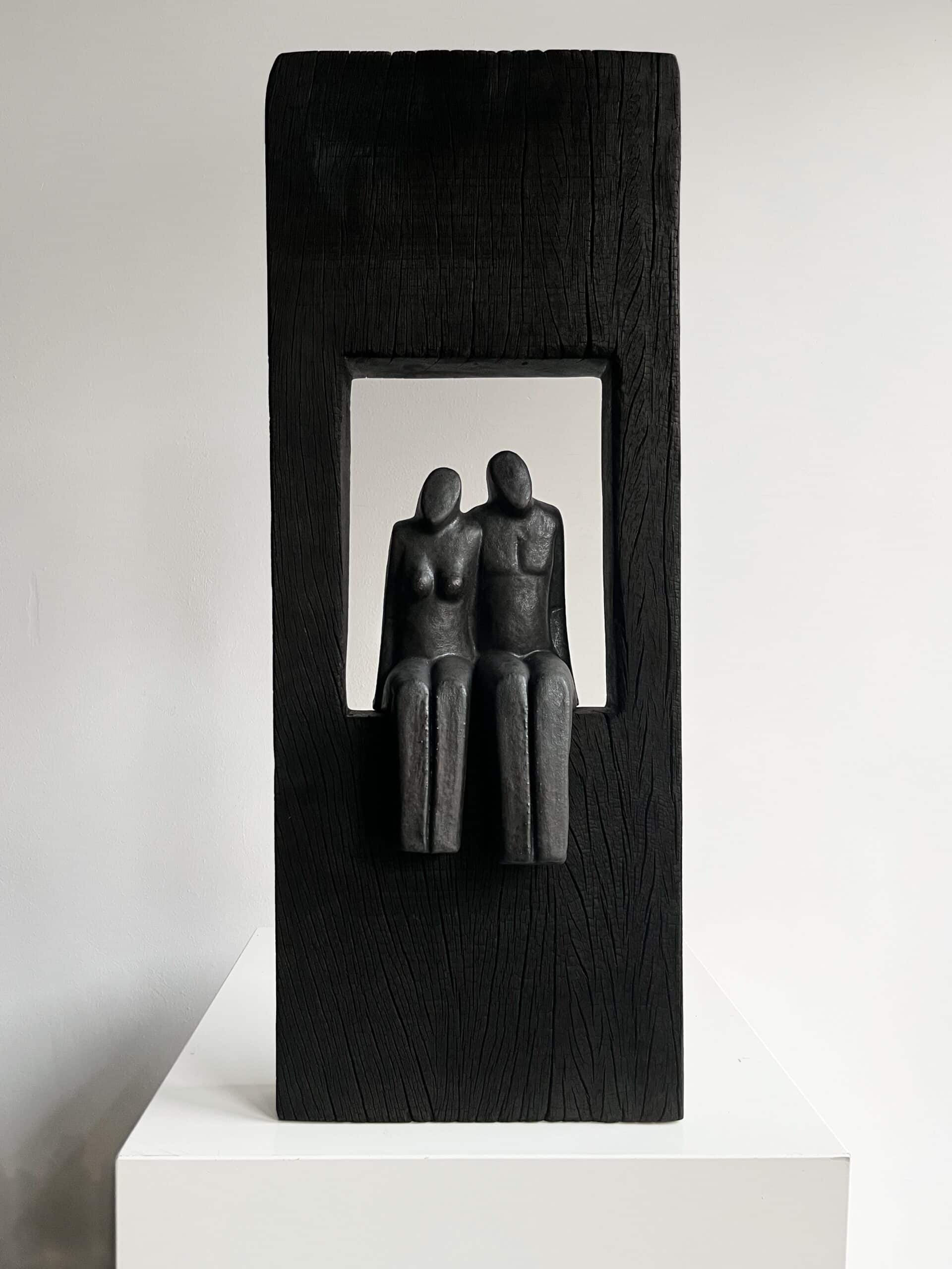 Het paar in zwart hout