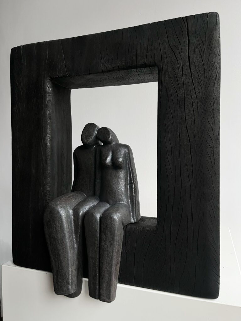 Het paar in zwart hout